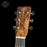 Gibson guitar headstock with brand name on a black background