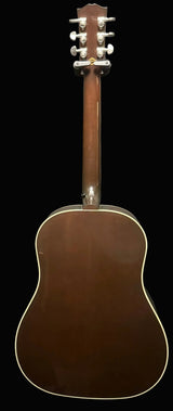 Acoustic guitar with a brown finish on a gray background