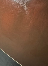 Close-up of a brown surface with visible scratches