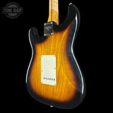 Electric guitar body with sunburst finish on a black background, featuring 'Tone Shop' logo.