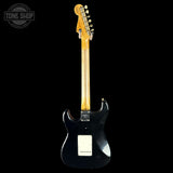 Black electric guitar with a blonde fretboard on a white background, featuring 'Tone Shop' branding.