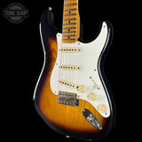 Fender Stratocaster guitar with a sunburst finish on a black background