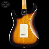 Electric guitar with a sunburst finish on a black background, featuring the Tone Shop logo.