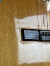 Close-up of a guitar's soundhole and body