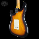 Electric guitar body with a sunburst finish on a black background, featuring the Tone Shop logo.