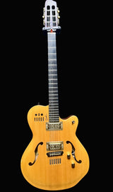 Electric guitar with a wooden body on a dark background