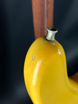 Close-up of a yellow banana with a dark background