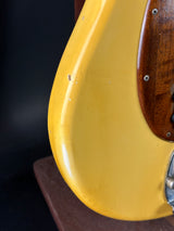 Close-up of a guitar's pickguard with a dark background