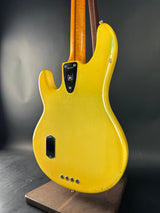 Yellow electric guitar body on a dark background