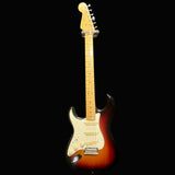 Electric guitar with a sunburst finish on a black background