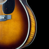 Front detail of Martin Custom Shop 28 Style OM Adirondack/Pacific Big Leaf Flamed Maple Ambertone.