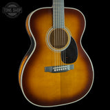 Front angle of Martin Custom Shop 28 Style OM Adirondack/Pacific Big Leaf Flamed Maple Ambertone.