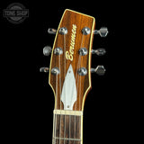 Guitar headstock with 'Berumen' branding on a black background