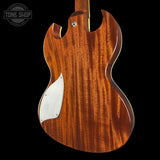 Wooden guitar body with a visible brand logo in the corner