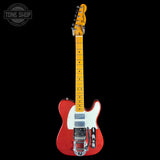A Fender Telecaster electric guitar with a red body, white pickguard, and yellow maple neck, shown against a solid black background. A 'Tone Shop' watermark is visible in the top-left corner.