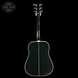 Back view of a black acoustic guitar on a white background with 'Tone Shop' logo.