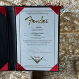 Fender certificate of authenticity on a textured surface