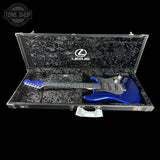 Blue electric guitar in a black case with Lexus logo on a black background