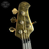 Headstock of Ernie Ball Music Man 50th Anniversary StingRay Molten Gold.
