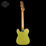 A single-cutaway electric guitar shown from the back, featuring a bright yellow-green glitter finish on the body, a natural wood neck, and a black tailpiece, set against a solid black background.