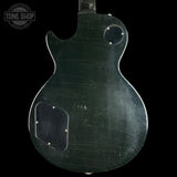 Back view of a guitar body with 'Tone Shop' logo in the corner.