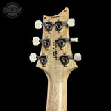 Guitar headstock with 'Wood Library' branding on a black background