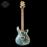 Blue electric guitar with a black background