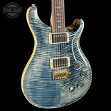 Blue electric guitar with a black background