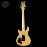 Wooden electric guitar on a black background with 'Tone Shop' logo.