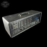 Guitar amplifier with control panel on a black background, featuring 'Tone Shop' branding.