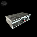 Guitar amplifier head with control panel on a black background, featuring the Tone Shop logo.