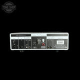 Back panel of a guitar amplifier with various controls and labels on a black background.