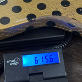 Rock N Roll Relics Revenge Jr Gold W/Black Polka Dots Relic on scale displaying weight.