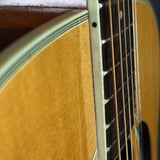 Close-up of an acoustic guitar's soundhole and strings