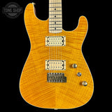 Electric guitar with a sunburst finish on a black background, featuring 'Tone Shop' branding.