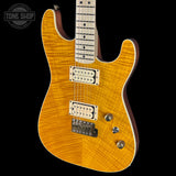 Electric guitar with a sunburst finish on a black background, featuring the Tone Shop logo.