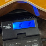 Gibson Les Paul Standard 50s Figured Top Honey Amber on scale displaying weight.