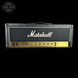 A Marshall JCM 800 LA-50S guitar amplifier head against a solid black background, featuring its signature black textured cabinet, white script logo, and gold control panel.