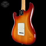 Electric guitar with a sunburst finish on a black background, featuring the Tone Shop logo.