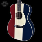 Front angle ofUsed Martin Custom Shop OM Red/White/Blue EIR/Sitka.