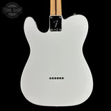 The back of a white Fender Telecaster electric guitar, showing the glossy white body, black hardware, and a light wood neck against a solid black background.