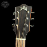 Guitar headstock with Guild logo on a black background