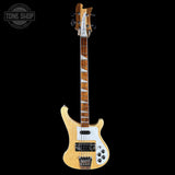 Electric bass guitar with a visible brand logo on a black background