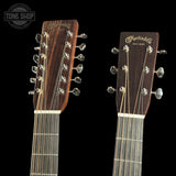 Two Martin guitar heads with brand logo on a black background