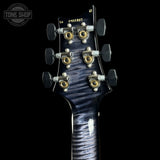 Back of headstock of PRS Wood Library Custom 24 Stoptail Limited Edition Purple Mist Stained Neck.