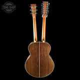 Back view of a wooden acoustic guitar with double necks on a black background, featuring 'Tone Shop' branding.
