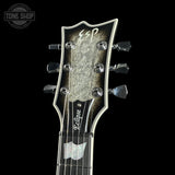ESP guitar headstock with 'Tone Shop' logo in the corner
