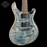 Front angle of PRS Wood Library Custom 24 Stoptail Limited Edition Faded Whale Blue Stained Neck.