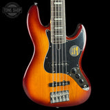 Electric bass guitar with a sunburst finish on a black background, featuring the Tone Shop logo.