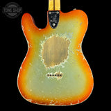 Vintage electric guitar with a sunburst finish on a black background, featuring the Tone Shop logo.